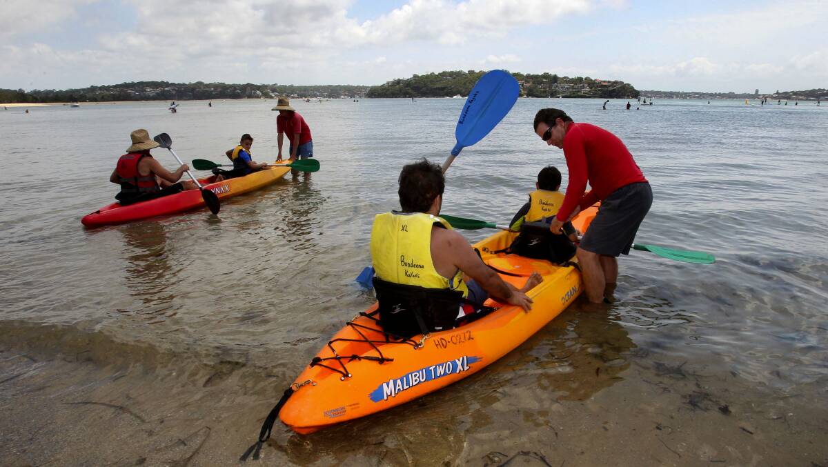Allaying concerns: Bruce Sigal helps launch a kayak at Bundeena.  Picture: Lisa McMahon
