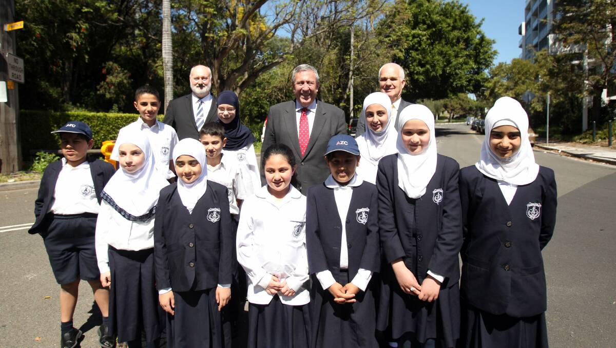 School safety: Al Zahra College students with Duncan Gay (rear middle), John Flowers (rear left) and principal Bruce Handley (rear right) at the announcement. Picture: Chris Lane
