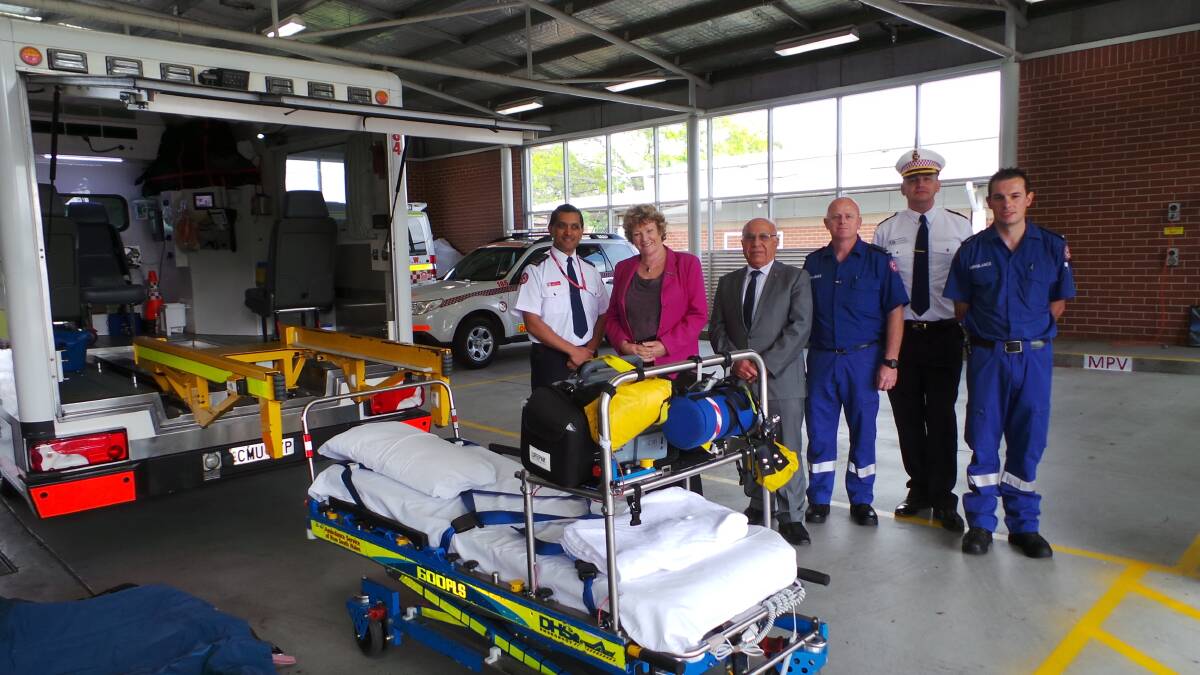 Jillian Skinner with ambulance officers at the launch of the new vehicles.