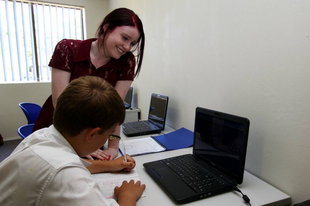 Career option: High school student Megan Evers, helps Mitch, 13, with his studies.