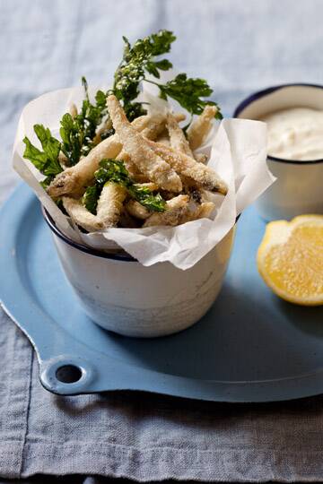 White bait chips with green tabasco mayonnaise. Karen Martini FISH recipes for Epicure and Good Food. Photographed by Marina Oliphant. Styling by Caroline Velik, dark blue linen from Minimax, linen runner from The Works, MUST CREDIT. PLEASE DO NOT CROP OUT FOREGROUND OF DISH OR IMAGE. The Age Newspaper and The Sydney Morning Herald.