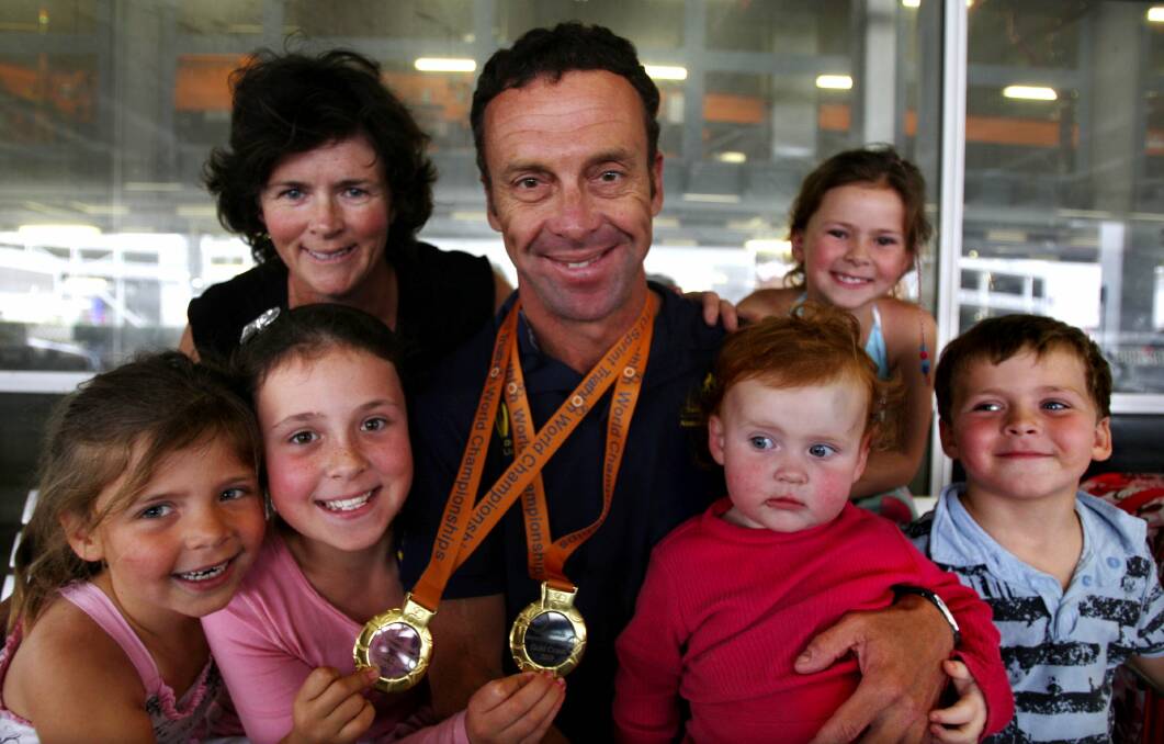 OAM: "Mick" Maroney with his family in 2009 after his world title wins.