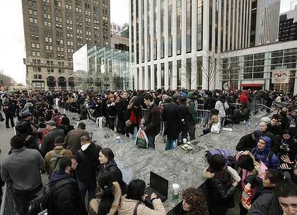 Brand appeal ... hundreds queued outside the Apple store in New York to buy the latest iPad 2.