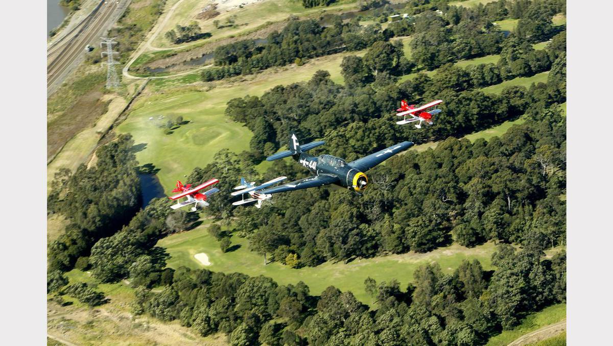 Royal Newcastle Aero Club celebrates its 85th anniversary, flying over Newcastle on Sunday. Photo: JONATHAN CARROLL