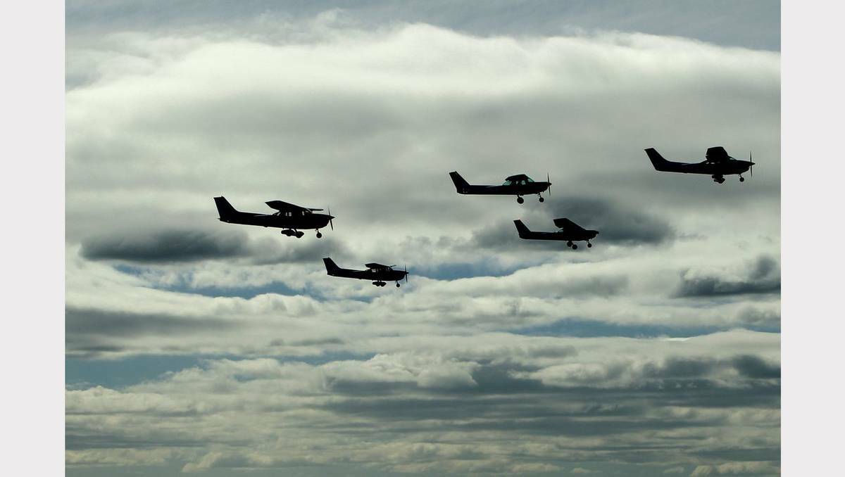 Royal Newcastle Aero Club celebrates its 85th anniversary, flying over Newcastle on Sunday. Photo: JONATHAN CARROLL