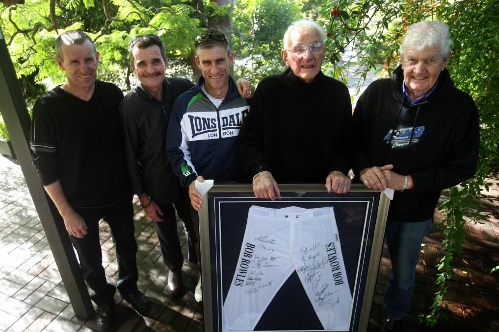 Respected: Bob Rowles is farewelled at his Oatley home with some framed racing silks by the racing fraternity. Pictured  (from left) are jockeys Rodney Quinn, Tony Marney and Adrian Layt, with Bob Rowles and great mate Rob Ogilvie (right), who takes over from him. Picture: John Veage