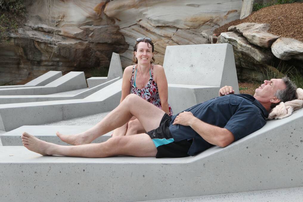 Southern comfort: Narelle and Adrian Howard (right)  enjoy the sun lounges. Pictures: John Veage