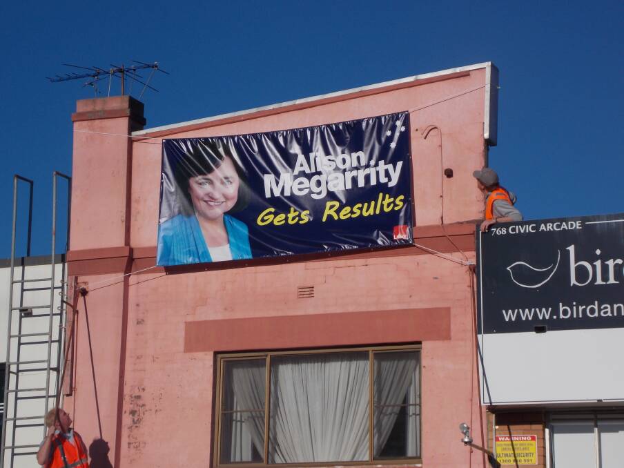 Open for business: The poster for Hughes candidate, Alison Megarrity is up on a building at Sutherland. 