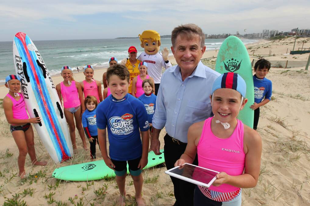 We can be heroes: Sonny the Lifeguard and mayor Steve Simpson are pictured with Wanda Nippers at the launch of the Surf Heroes website.  Picture: John Veage