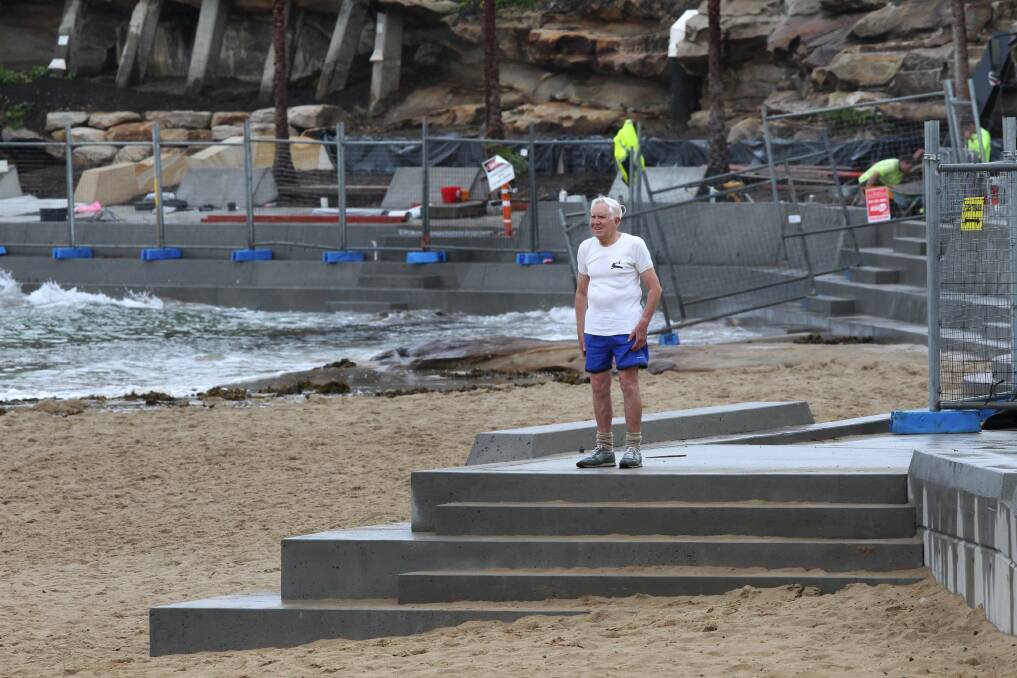 Major concern: John Brett at Cronulla beach. Inset, high tide tests the new structure.  Pictures: John Veage