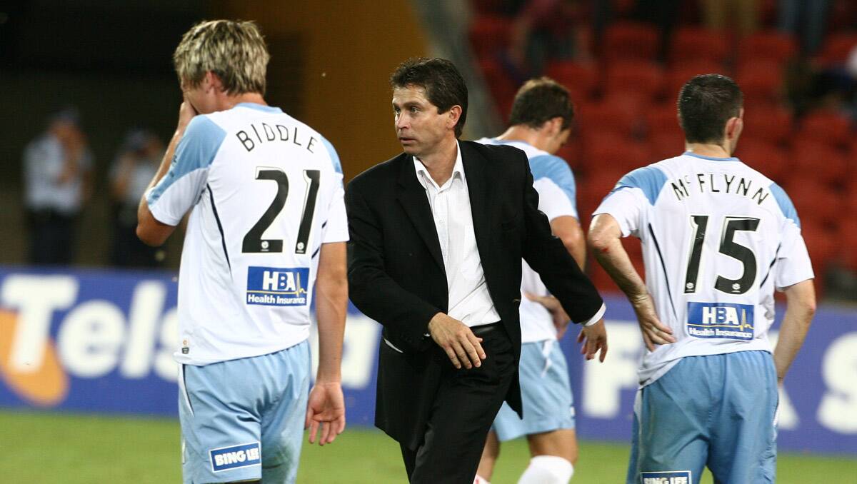 Former Brisbane Roar and now Sydney FC coach, Frank Farina, walks past Sydney players shaking hands after a match at Suncorp Stadium in 2008. Picture Paul Harris